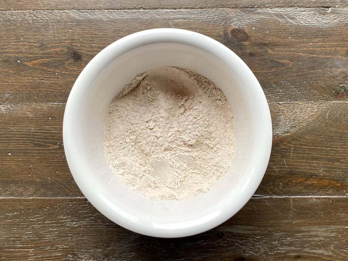 Dry ingredients in a large white bowl.